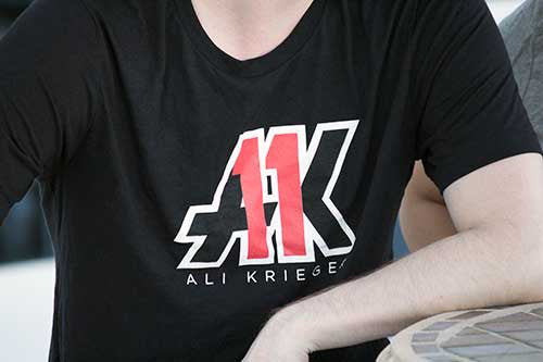 AK11 Logo T-Shirt in black front on guy